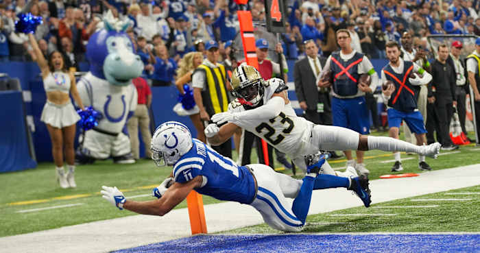 Indianapolis Colts wide receiver Michael Pittman Jr. (11) scores a first quarter touchdown as he is defended by New Orleans Saints cornerback Marshon Lattimore (23), Sunday., Oct 29, 2023, at Lucas Oil Stadium in Indianapolis.